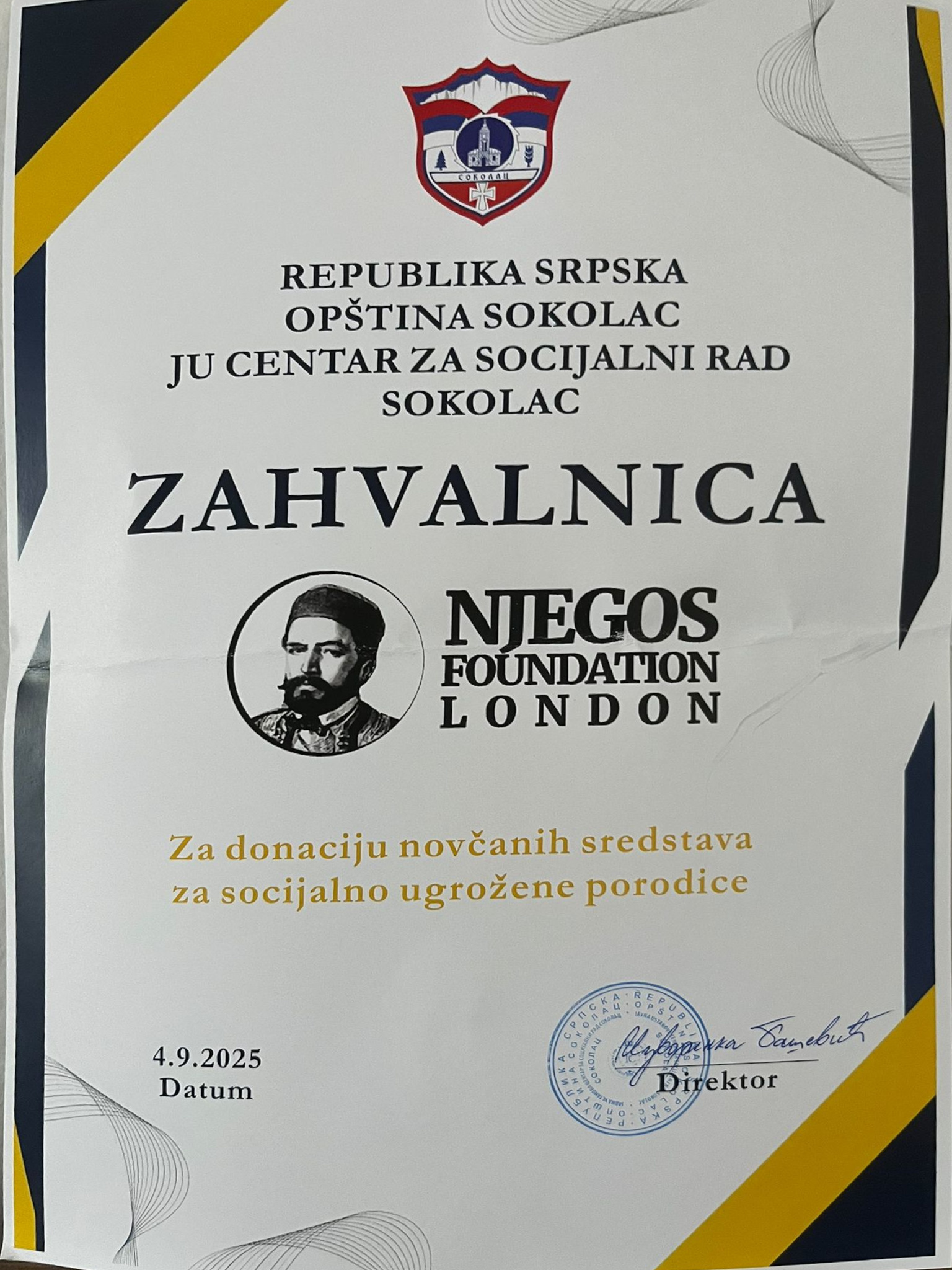 Izvorinka Bašević, acting director of the Sokolac Center for Social Work presented this certificate to recognise financial assistance provided for 20 large families in the region